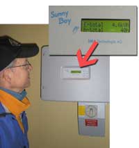 Mel checking the read-out on our Sunny Boy inverter